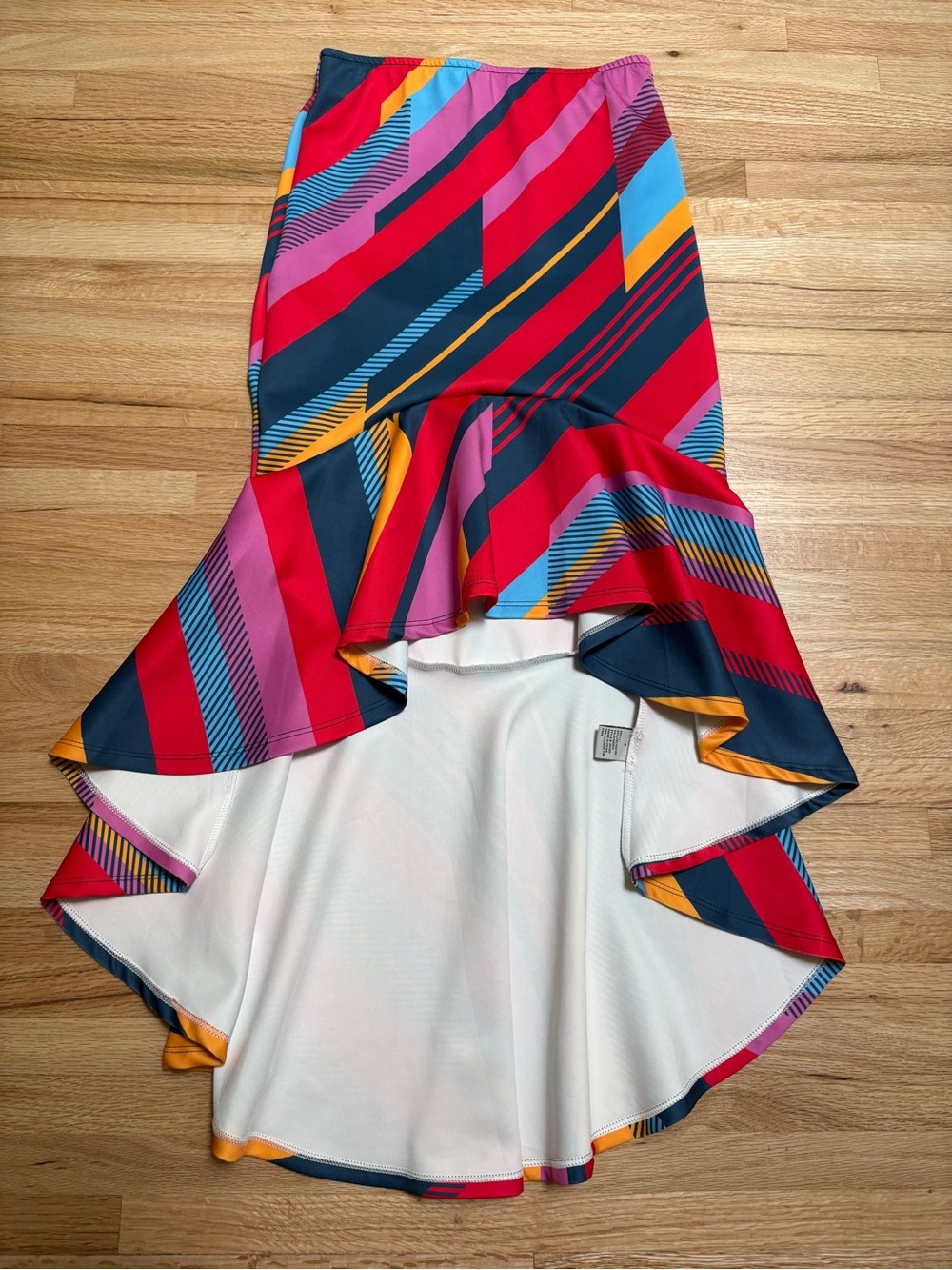 colorful geometric skirt features flowing asymmetrical ruffled hemline- size S